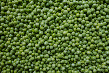 Fototapeta na wymiar Lot of fresh beans. peas peeled on nature background. Green texture