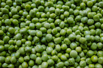 Lot of fresh beans. peas peeled on nature background. Green texture