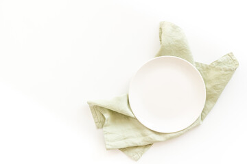 Table setting top view. Empty plate on napkin - dishware for dinner