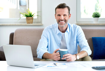 Home budget, finances concept with handsome man