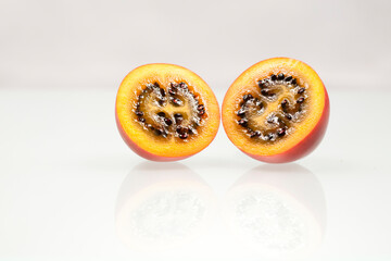 Passion fruit slices with white background