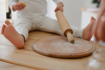 person kneading dough