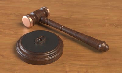 Wedding rings and wooden gavel of judges on the table close up. 3d rendering
