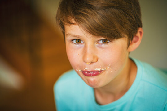 Smiling Boy Eating Cake