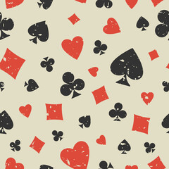 Seamless grunge pattern with card suits - hearts, clubs, spades and diamonds.
