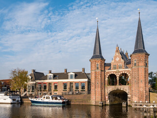 Fototapeta na wymiar Waterpoort, water gate, and Kolk canal in city of Snits, Sneek in Friesland, Netherlands