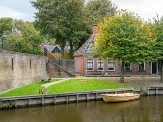Fototapeta na wymiar Lindengracht quay and fortifications in old town of Sloten, Sleat, Friesland, Netherlands