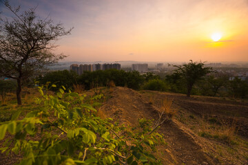Fototapeta na wymiar Early morning view from the hill top, a part of Pune city at the distance. 
