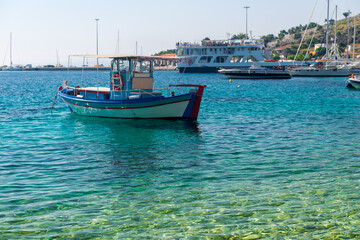 Fototapeta premium boats sway on the turquoise waves of the Ionian sea of Greece in sunny weather