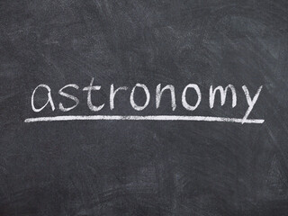 astronomy concept word on blackboard background