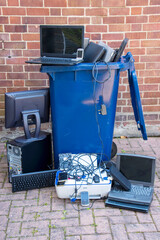 Discarded hardware put into a recycling container.