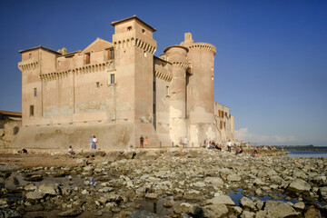 The ancient medieval castle of Santa Severa with warm daylight , long exposure shot , Rome , Lazio , Italy