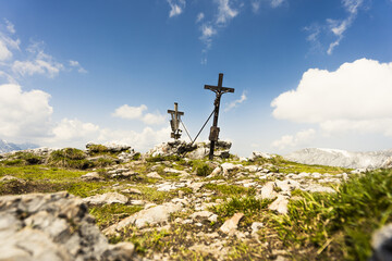 Mountain summit cross on the top of the alps