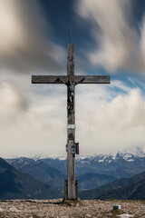 Mountain summit cross on the top of the alps