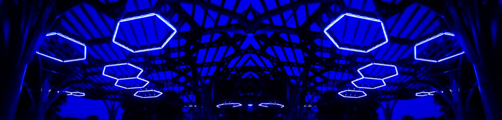 Horizontal banner - blurred image of futuristic illumination lighting on a blue background. Place for your text.