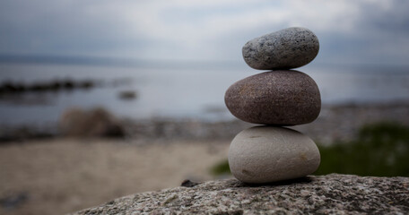 pyramid of stones on the background of the sea