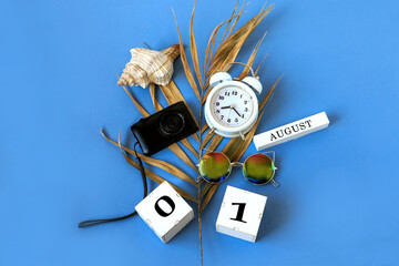 Calendar for August 1 : the name of the month of August in English, cubes with the numbers 0 and 1,...