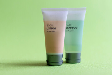 Close up shot of shampoo and body lotion tubes. Cosmetics