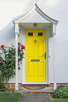 Beautiful Yellow Front Door Of English Flat House 