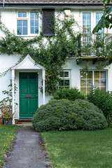 Beautiful front green garden of English house.