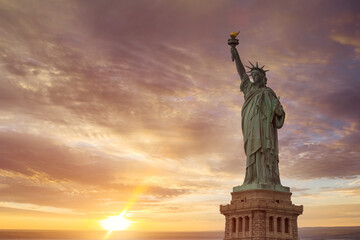 Fototapeta premium Aerial view of Statue of Liberty at sunrise in New York City