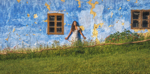 Exotic woman on the farm with flowers.