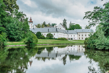 Fototapeta na wymiar Velke Losiny Castle in Czech spa town,East Bohemia,Jeseniky Mountains,Czech Republic.Romantic Renaissance chateau with sgraffito decoration reflected in water,surrounded by beautiful park.Travel scene