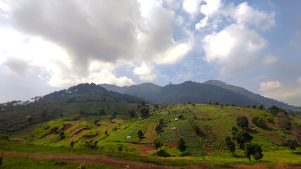 photo of the Zandea hill, which is partially covered by clouds and not exposed to sunlight, located in the Cikancung area, Indonesia