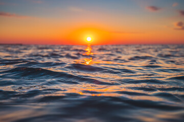 Sea wave close up, low angle view, sunrise shot