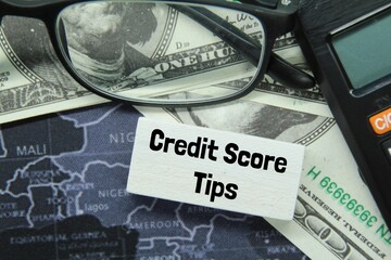 calculator, banknotes, world map, with word credit score tips
