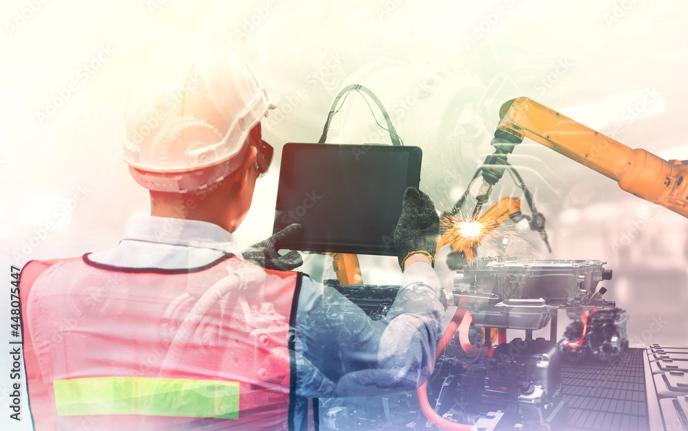 Poster mechanized industry robot arm and factory worker double exposure . concept of robotics technology fo