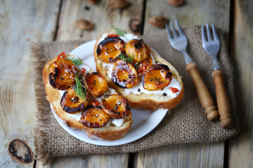 Bruschetta with dried apricots. Healthy sandwiches with apricot and white cheese.