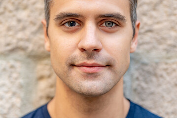 Close up portrait of latin man with heterochromia