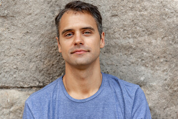 Young latin man with heterochromia smile to the camera