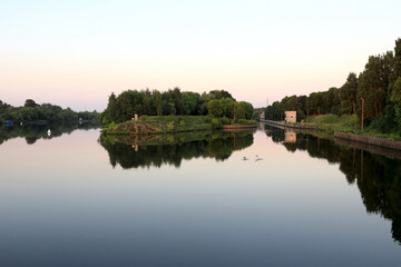Landscape of old lock on Oka river at sunset