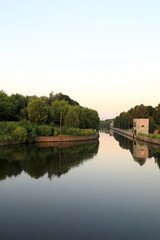 Fototapeta na wymiar Old lock on Oka river at sunset