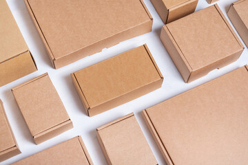 Lot of flat brown and white cardboard boxes - obrazy, fototapety, plakaty