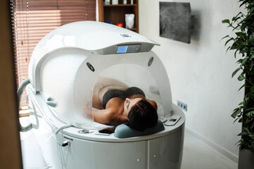 Modern capsule for hydrotherapy in a beauty salon for women
