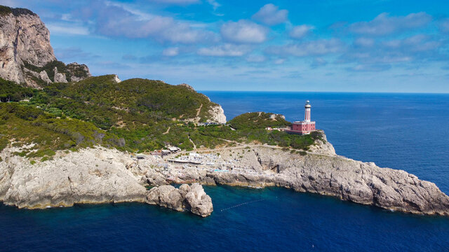 Amazing aerial view of Capri coastline along the lighthouse in summer season.
