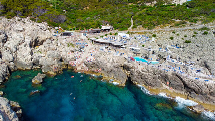 Amazing aerial view of Capri coastline along the lighthouse in summer season.