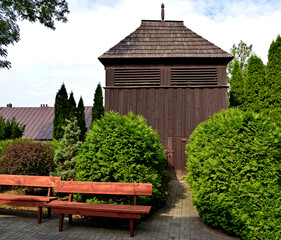 A wooden belfry and a brick chapel from the 16th century and a wooden Catholic church of Saint Zygmunt added to it in the 18th century in the town of Kraszewo in Mazovia, Poland.