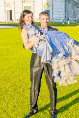 Groom picking up his Wife in Pisa