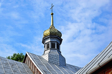 A wooden belfry and a brick chapel from the 16th century and a wooden Catholic church of Saint...