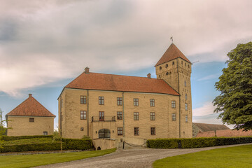 Fototapeta na wymiar the yellow Tosterup castle in the swedish province of scania has a very high tower