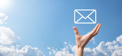 Businessman hand holding e-mail icon, Contact us by newsletter email and protect your personal...