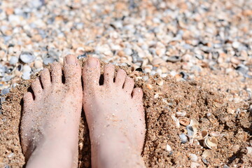 Fototapeta na wymiar feet on sand
