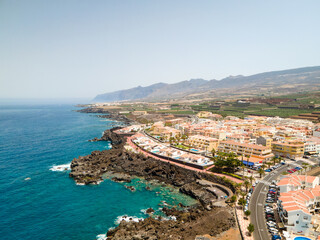 Tenerife, San Juan a town on the Atlantic Ocean. Sunny coast and port city. Ocean, water, waves,...