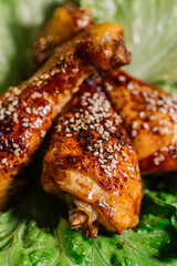 Roasted chicken thighs on a green salad 