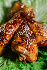 Roasted chicken thighs on a green salad 