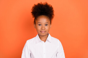 Photo of young attractive african girl happy positive smile confident wear shirt isolated over orange color background